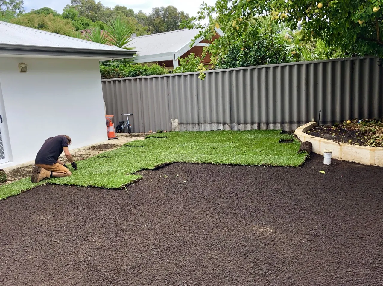 Laying turf for a new Perth landscape package
