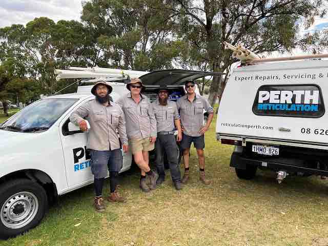 Perth Reticulation Experts team beside their work utes
