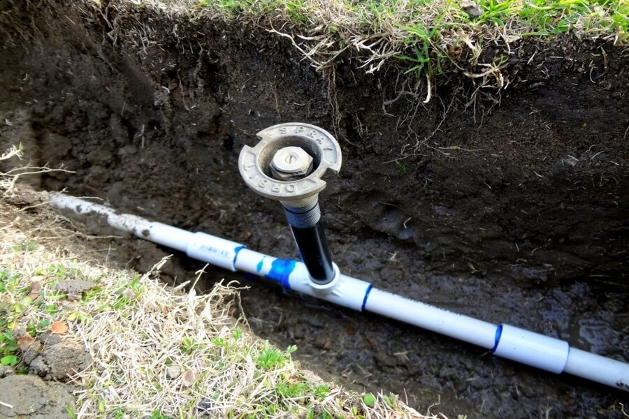 Sprinkler in trench