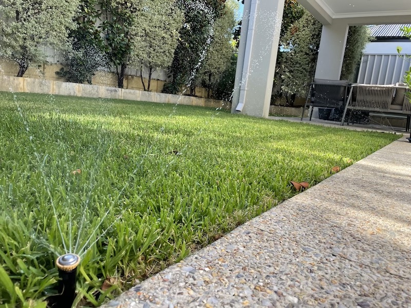 Green lawn with sprinkler reticulation