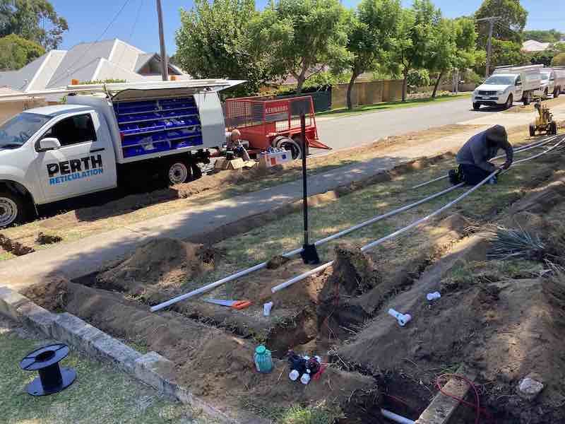 reticulation technicians installing lawn irrigation system