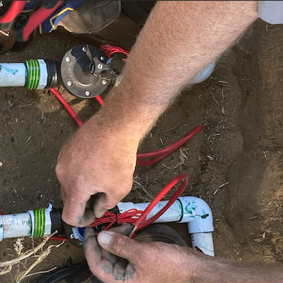 reticulation technician repairing solenoid valves