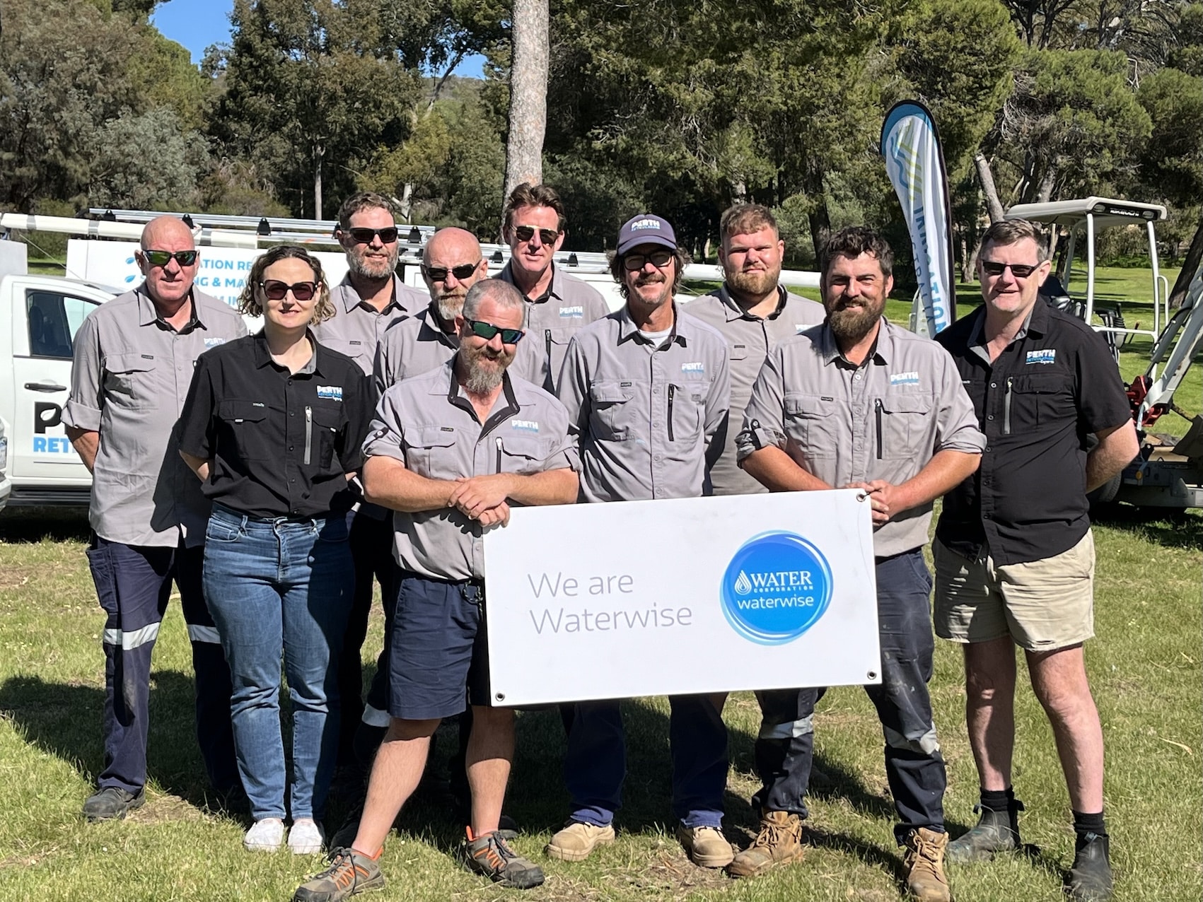 reticulation technicians team photo with waterwise certification sign